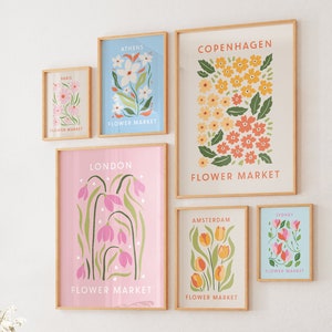 Set of 6 flower market wall art prints in pink, green, and orange, framed