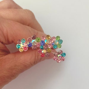 Multicolored crystal hairpins with pink, blue, green and gold flower shapes