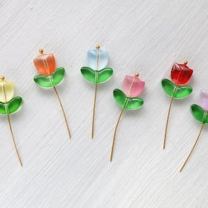 Tulip flower and leaf glass bead charms on gold-toned pin stems, green and red