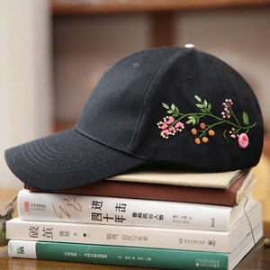 Floral embroidered baseball cap, dark fabric, curved brim