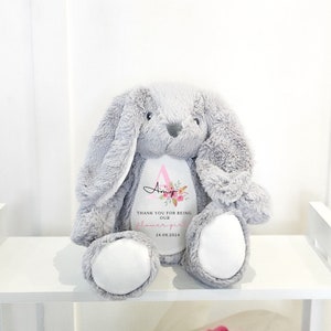 Personalised grey plush bunny with embroidered flower heart and small text on belly