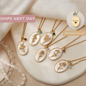 Gold birth-flower oval pendant necklaces with small birthstone accents on chains
