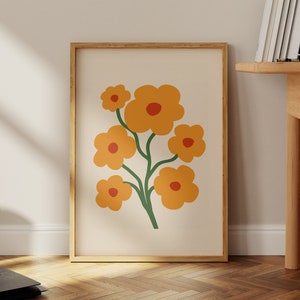 Framed retro flower print wall art with orange and red blooms on light background