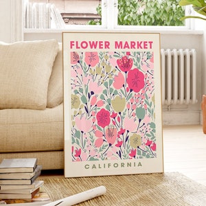 Colorful floral wall art print with pink and green blooms in a cream frame