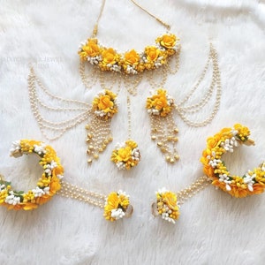 Handmade mehndi jewelry set with white pearl chains and yellow flower accents