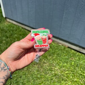 Professional cracker sticker badge in hand, red and green cartoon style