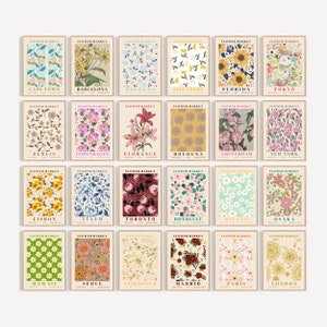 Set of 24 framed flower market posters, colorful botanical prints with city-name text.