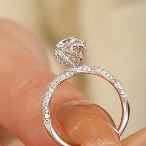 Silver twisted halo ring with clustered round stones