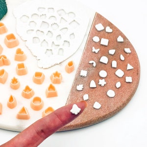 Mini triangle clay cutter tool with multiple small square and rectangle cutouts