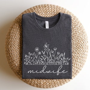 Dark gray crewneck midwife shirt with white floral line art and script "midwife"