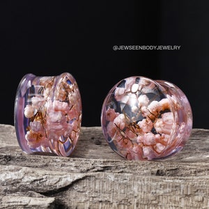Pair of resin flower ear tunnels with pink and clear petals, round plug earrings