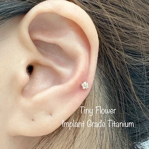 Titanium internally threaded labret stud with tiny pink CZ flower for cartilage