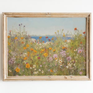 Framed wildflower landscape print with colorful flowers, blue water horizon, wooden frame