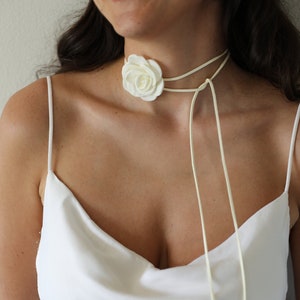 Ivory velvet ribbon choker with large white rose flower and bow ties