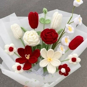 Crochet flower bouquet with red, white, and green blooms and small blossoms
