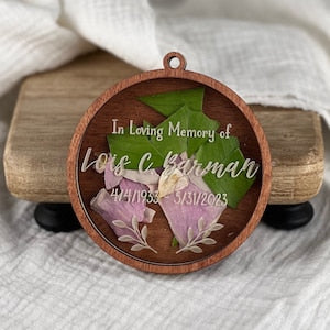 Memorial keepsake ornament, round wood with “In Loving Memory of” and purple flowers