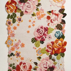 Irregular multicolored floral hand-tufted wool area rug with roses and blossoms