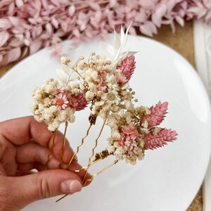 Dried flower hair pins with blush pink and white blooms on gold-tone wires