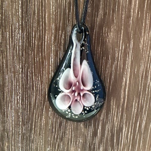 Flower drop pendant necklace with teardrop charm and pink triple-petal flower