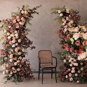 Artificial floral wedding arch arrangement with dusty pink blush roses and greenery