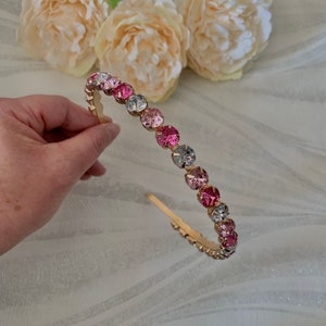 Pink and clear crystal headband with gold-tone metal frame