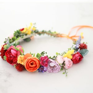 Colorful floral crown headband with bright fabric flowers and ribbon ties