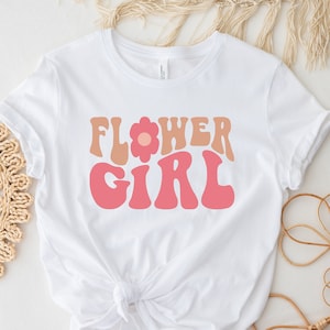 White short-sleeve flower girl T-shirt with colorful “FLOWER GIRL” graphic