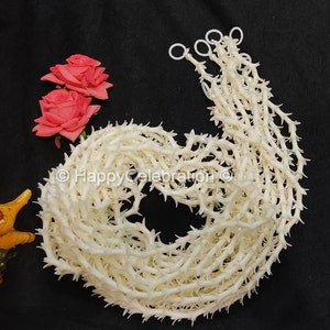 White artificial floral curtain string with crescent garland detail