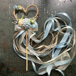 Decorative flower girl wand with butterfly top, dusty blue ribbons and lace
