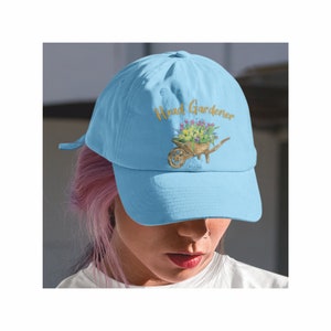 Light blue baseball cap with embroidered garden logo on the front