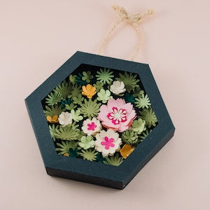 DIY flower box craft kit: dark blue octagonal box with faux flowers and greenery