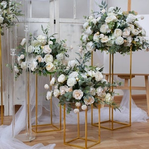 Artificial white and green flower ball centerpiece on gold stand