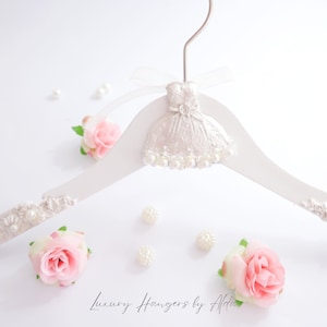 Child flower girl dress hanger with white satin lace bodice and pink fabric roses