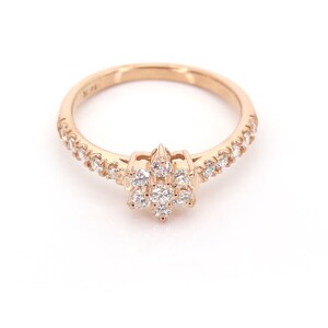 Rose gold flower diamond ring with pavé band and cluster center