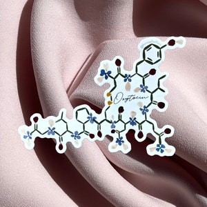 Oxytocin pressed-flower vinyl sticker with blue floral design and chemical motif