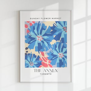 Framed flower market poster with blue/pink floral art and “THE ANNEX TORONTO”