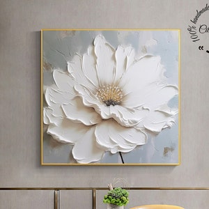 Large white textured floral canvas painting with raised flower petals, gold frame