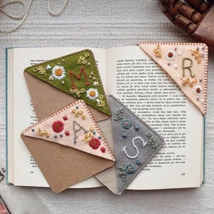 Felt bookmark set with embroidered letters and small flower motifs, assorted colors
