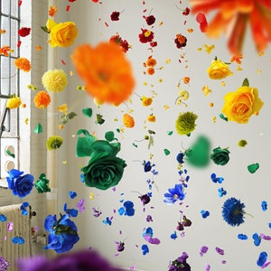 Multicolor hanging flower garland with layered artificial blooms and pom-pom flowers