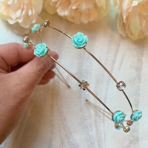 Gold double band hairband with turquoise flower accents and rhinestone details