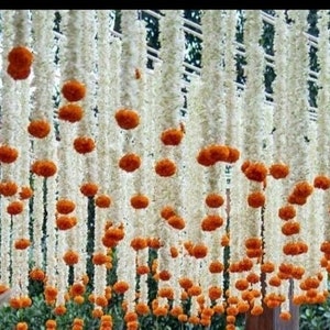 Artificial jasmine and marigold flower string decorations, hanging white and orange blossoms