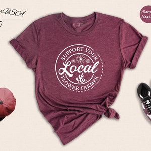 Maroon flower farmer graphic T-shirt with circular Local text and front knot