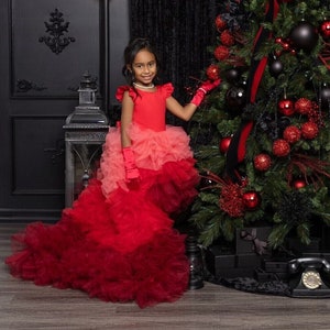 Red sleeveless tulle birthday dress with layered ruffles and short train