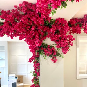 Artificial bougainvillea flower garland with dense pink faux blooms, cascading
