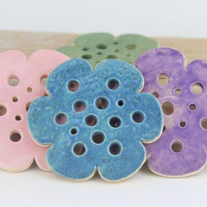 Flower-shaped ceramic flower frog holder with round pinholes, pastel blue