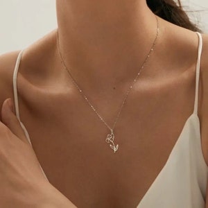 Dainty flower pendant necklace with thin chain and small charm