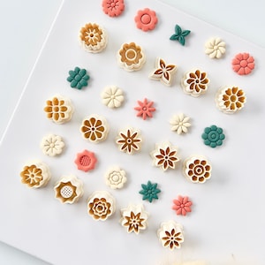 Floral clay earring cutter set with 15 flower-shaped stud molds, assorted colors