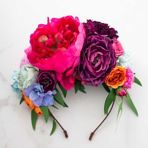 Boho floral hairband with large pink, purple, orange flowers on dark band
