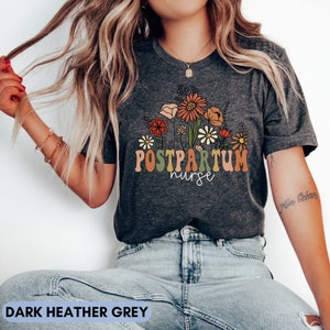 Postpartum nurse t-shirt, dark heather grey with flower and 'Postpartum' graphic
