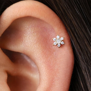 Small diamond flower cartilage stud with cluster of clear stones on ear